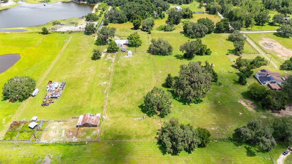 38730 Mickler Road Dade City, FL 33523 - Photo 33 of 38 a view of a lake with a houses