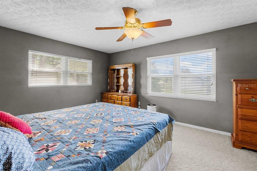 38730 Mickler Road Dade City, FL 33523 - Photo 6 of 38 a bedroom with a bed and a window