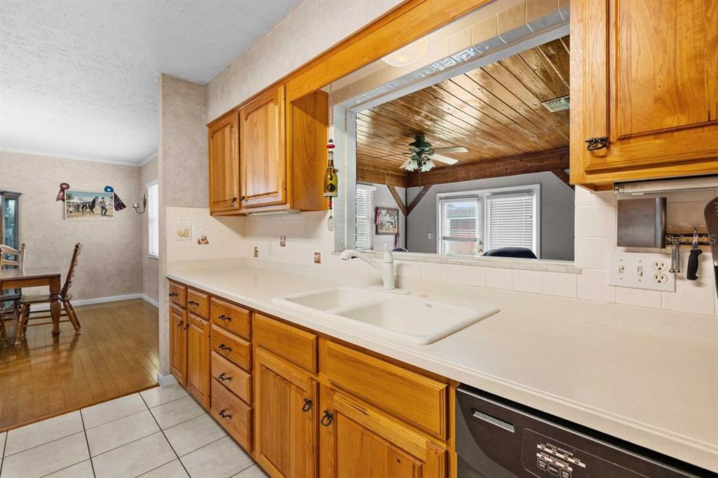 38730 Mickler Road Dade City, FL 33523 - Photo 10 of 38 a kitchen with granite countertop a sink and a stove