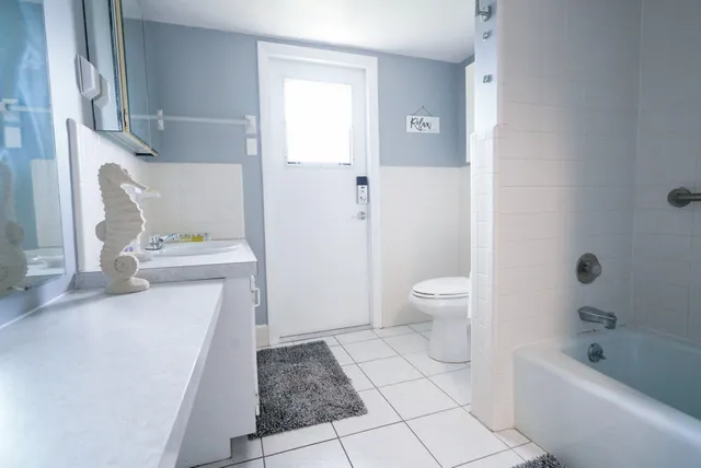 a bathroom with a bathtub and shower