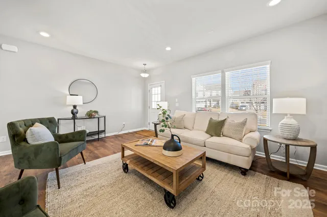 a living room with furniture and a lamp