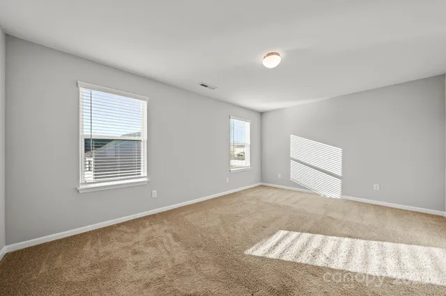 a bathroom with a double vanity sink mirror and toilet