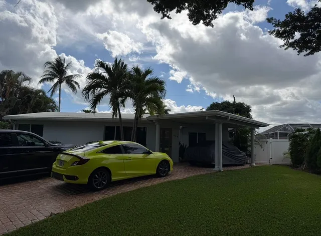 a car parked in front of the house