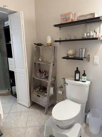 a couple of cars parked in front of a house