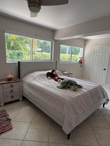 a bedroom with a bed and a window in it