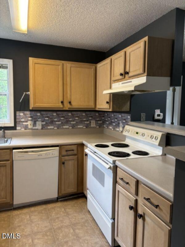 2000 University Woods Road, Unit 304 Raleigh, NC 27603 - Photo 3 of 8 a kitchen with granite countertop cabinets stainless steel appliances and a sink