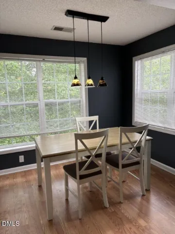 a view of a dining room with furniture window and outside view
