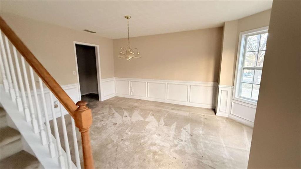 65 Montgomery Court Covington, GA 30016 - Photo 2 of 11 a view of an empty room with stairs