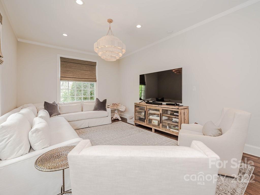 415 Ashworth Road Charlotte, NC 28211 - Photo 14 of 43 a living room with furniture and a flat screen tv
