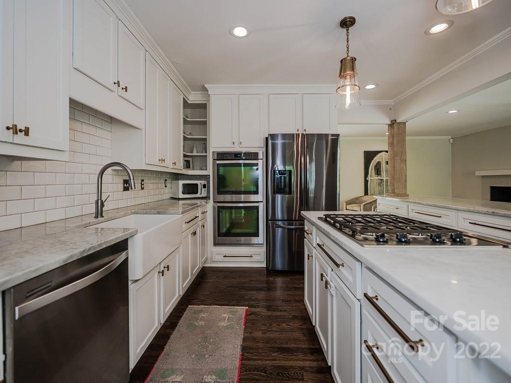 415 Ashworth Road Charlotte, NC 28211 - Photo 17 of 43 a kitchen with stainless steel appliances a sink stove and refrigerator