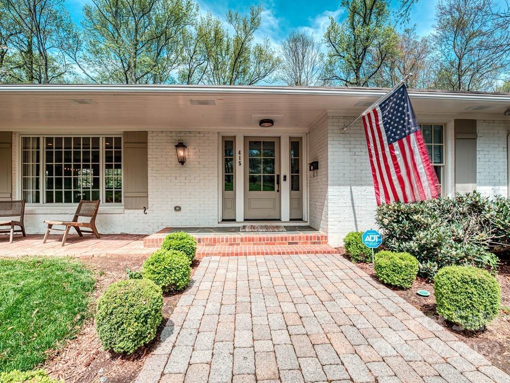 415 Ashworth Road Charlotte, NC 28211 - Photo 2 of 43 a front view of a house with garden