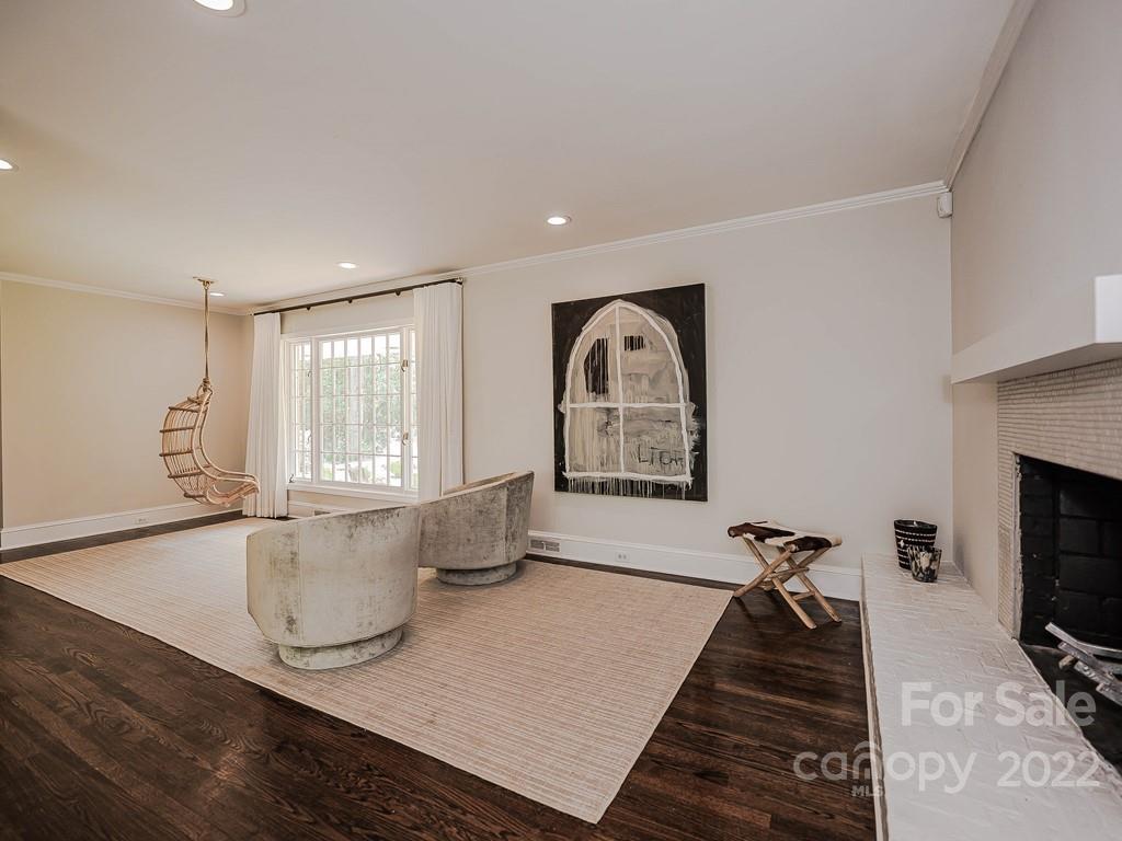 415 Ashworth Road Charlotte, NC 28211 - Photo 25 of 43 a living room with furniture a flat screen tv and a fireplace