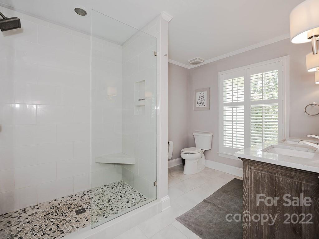 415 Ashworth Road Charlotte, NC 28211 - Photo 29 of 43 a bathroom with a sink toilet and shower