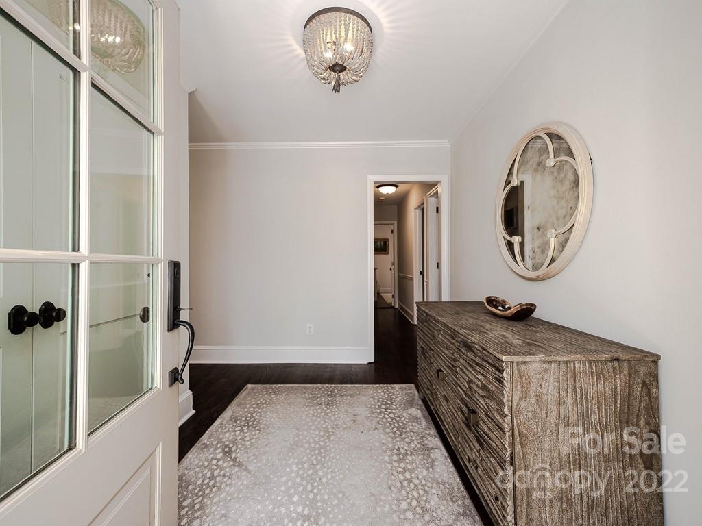415 Ashworth Road Charlotte, NC 28211 - Photo 3 of 43 a bathroom with a granite countertop sink and a mirror