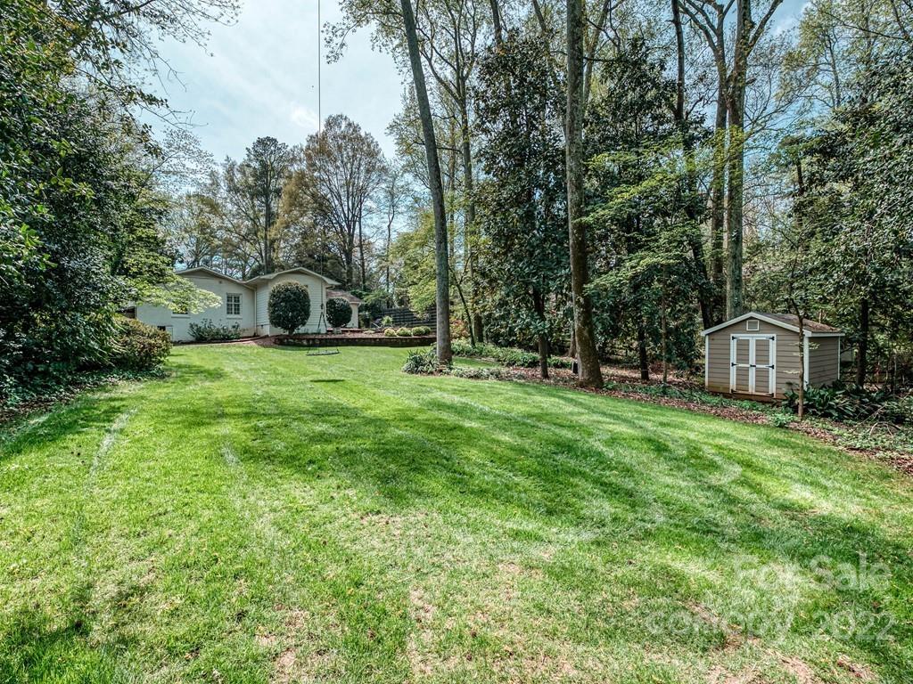 415 Ashworth Road Charlotte, NC 28211 - Photo 40 of 43 a view of a trees and barn in the back yard