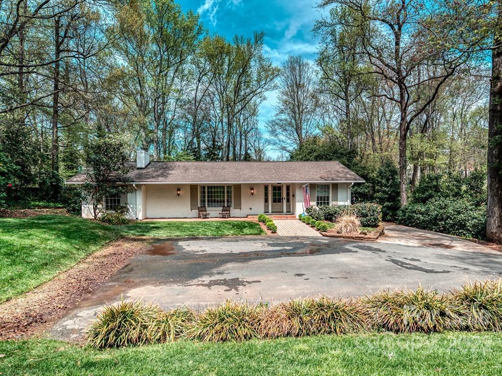 415 Ashworth Road Charlotte, NC 28211 - Photo 43 of 43 a front view of a house with a garden