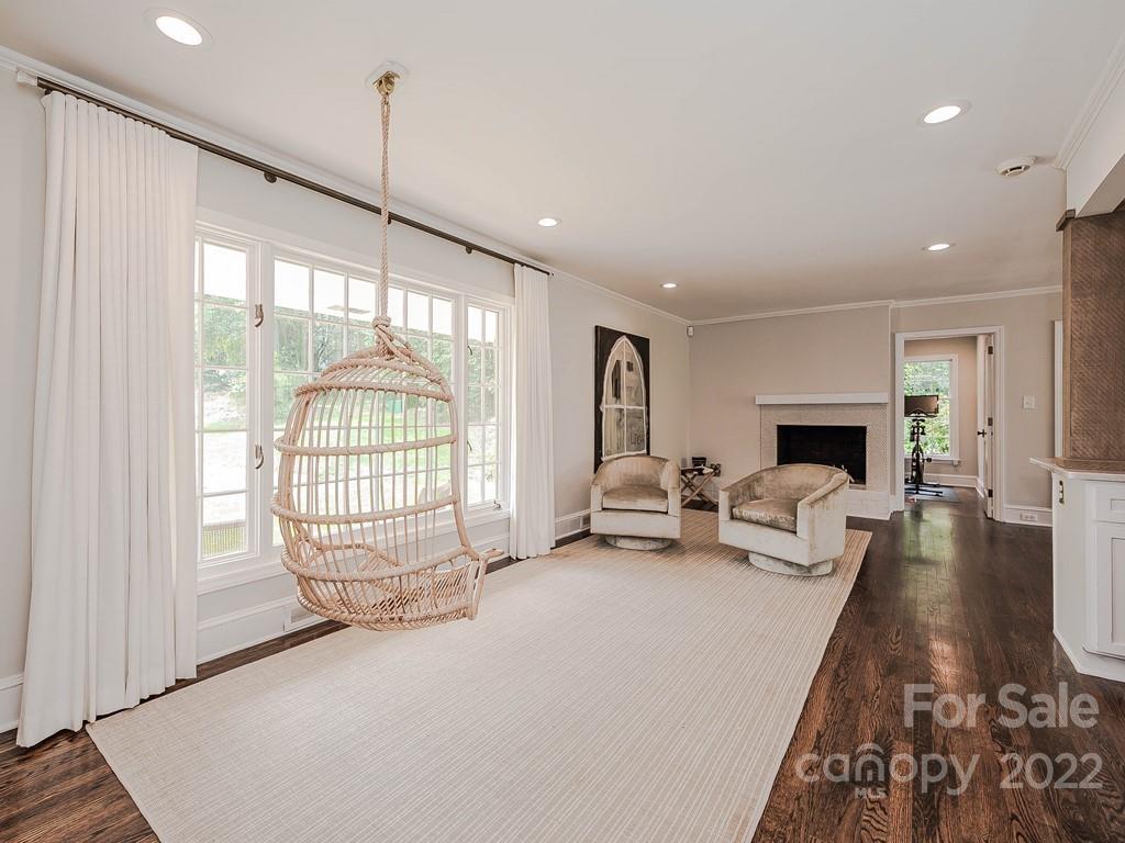 415 Ashworth Road Charlotte, NC 28211 - Photo 5 of 43 a living room with furniture fireplace and a large window