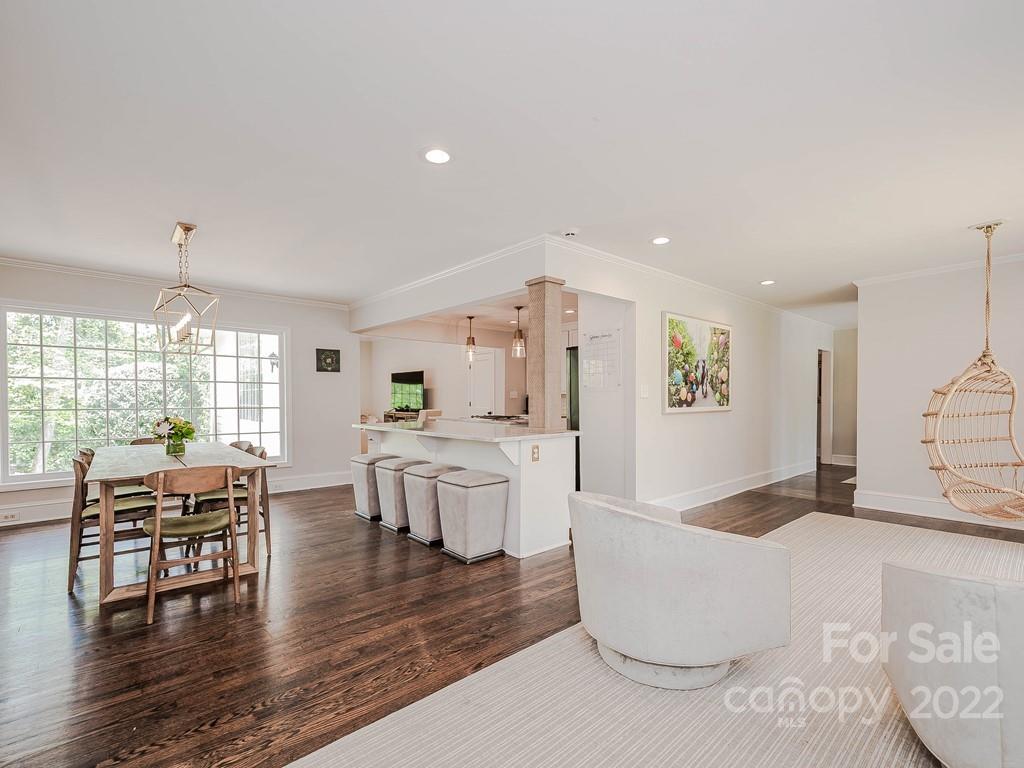 415 Ashworth Road Charlotte, NC 28211 - Photo 6 of 43 a living room with couches and kitchen view with wooden floor