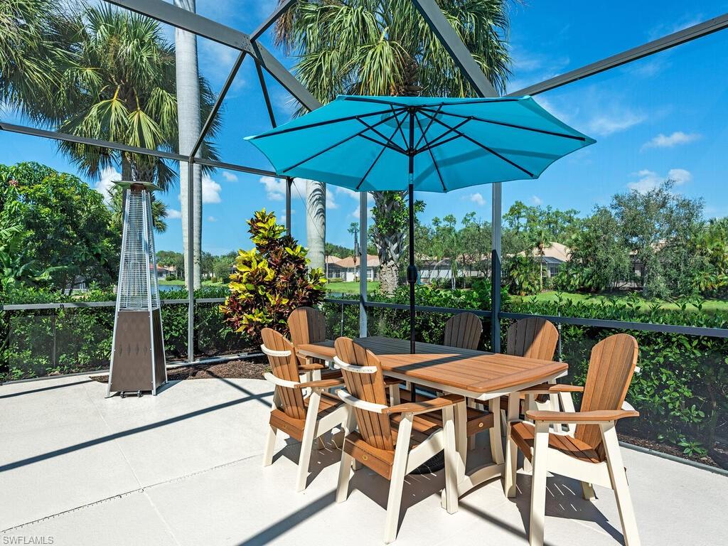 16105 Parque Lane Naples, FL 34110 - Photo 17 of 34 a view of an outdoor sitting area with furniture and backyard