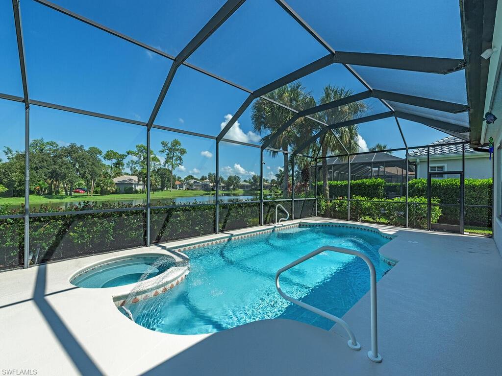 16105 Parque Lane Naples, FL 34110 - Photo 19 of 34 a view of a backyard with swimming pool