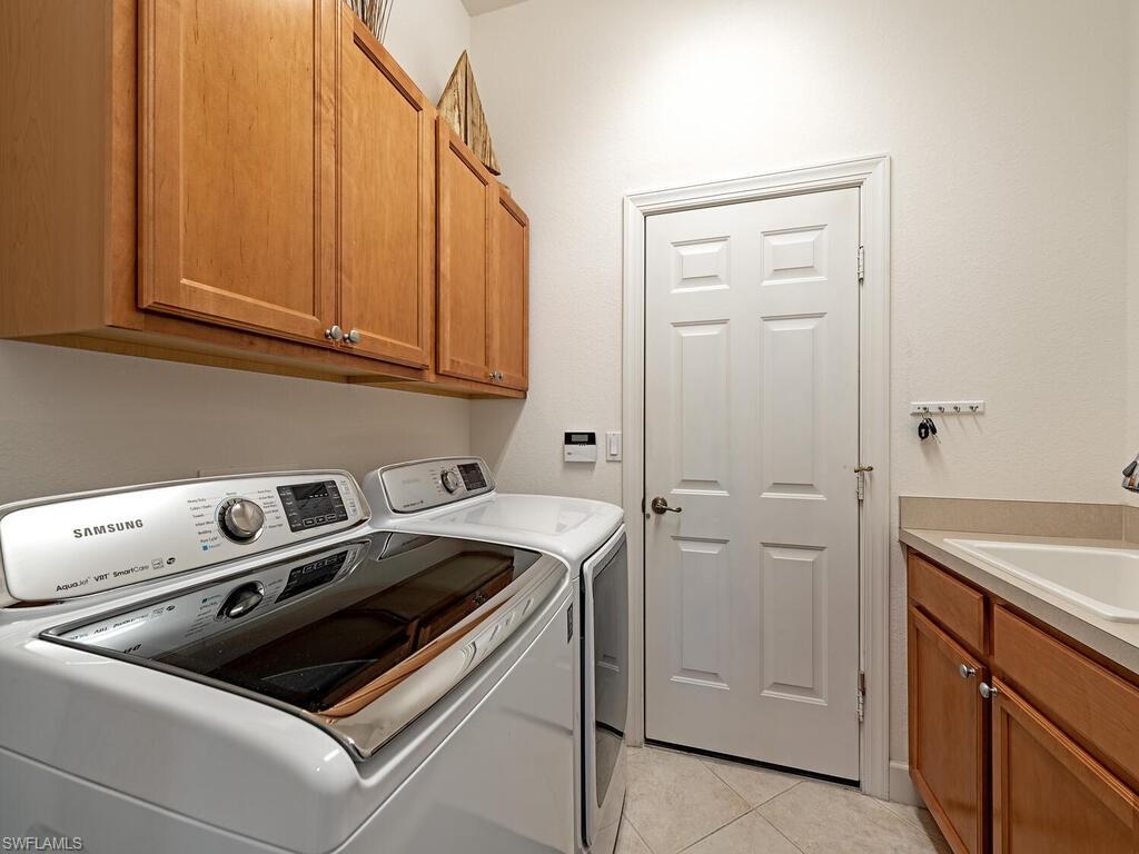 16105 Parque Lane Naples, FL 34110 - Photo 20 of 34 a utility room with dryer and washer