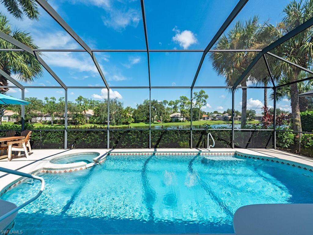16105 Parque Lane Naples, FL 34110 - Photo 2 of 34 a view of a backyard with sitting area