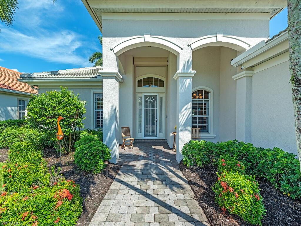 16105 Parque Lane Naples, FL 34110 - Photo 21 of 34 a view of front door and small houses