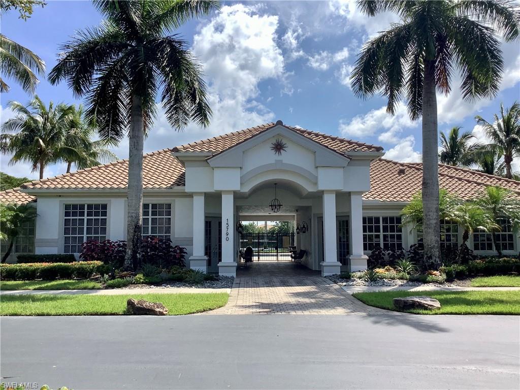 16105 Parque Lane Naples, FL 34110 - Photo 23 of 34 a front view of a house with a garden and patio