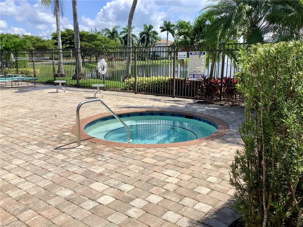 16105 Parque Lane Naples, FL 34110 - Photo 25 of 34 a view of a swimming pool with a patio