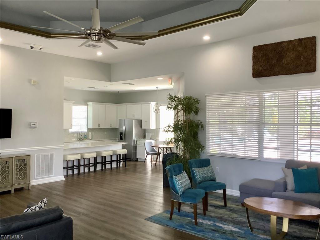 16105 Parque Lane Naples, FL 34110 - Photo 26 of 34 a living room with furniture and a flat screen tv