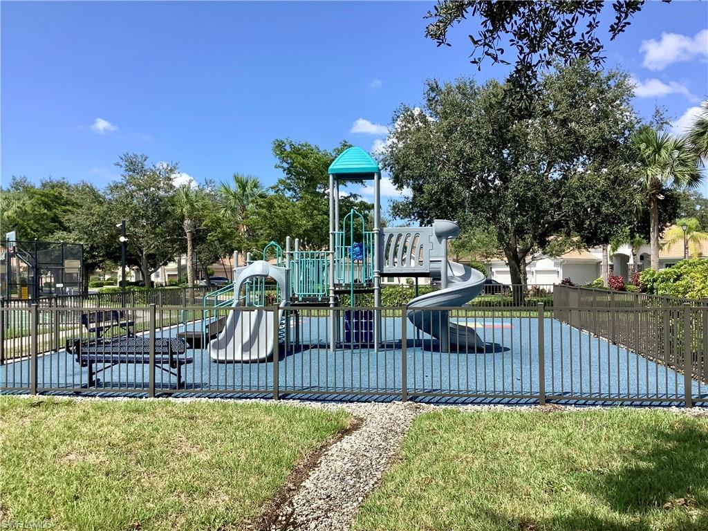 16105 Parque Lane Naples, FL 34110 - Photo 32 of 34 a view of a deck with a wooden fence and a bench