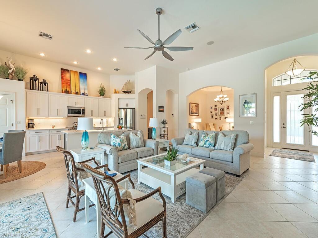 16105 Parque Lane Naples, FL 34110 - Photo 5 of 34 a living room with lots of furniture and a large window