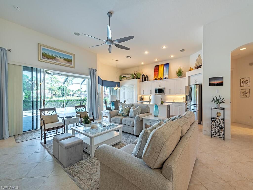 16105 Parque Lane Naples, FL 34110 - Photo 7 of 34 a living room with furniture and a large window