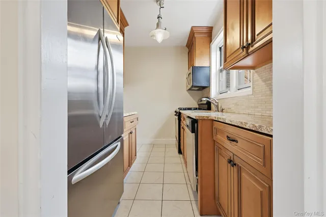 a bedroom with a bed and a chair