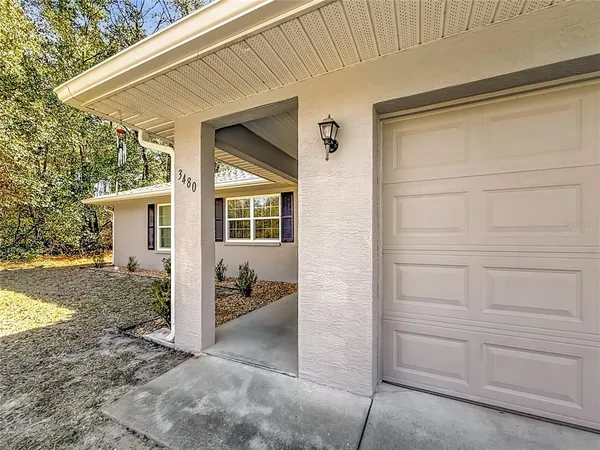 a view of a house with a back yard