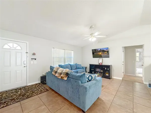 a living room with furniture and a table