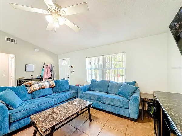 a living room with furniture and a large window