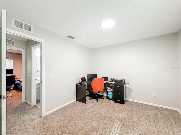 a bedroom with a bed and a table in it