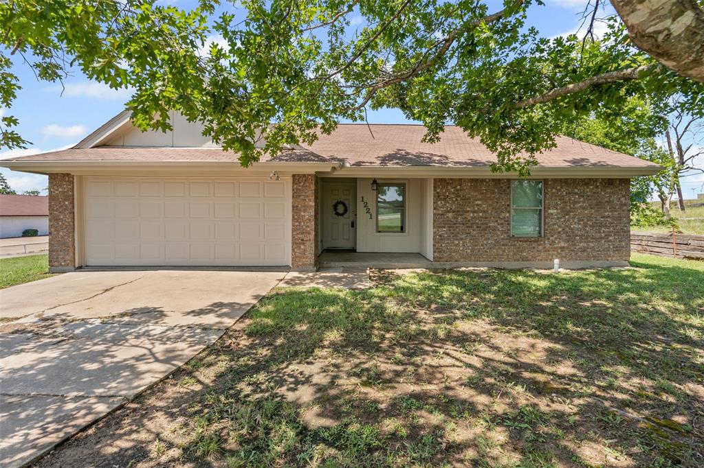 1221 East Fm 4 Cleburne, TX 76031 - Photo 1 of 35 a front view of a house with a garden
