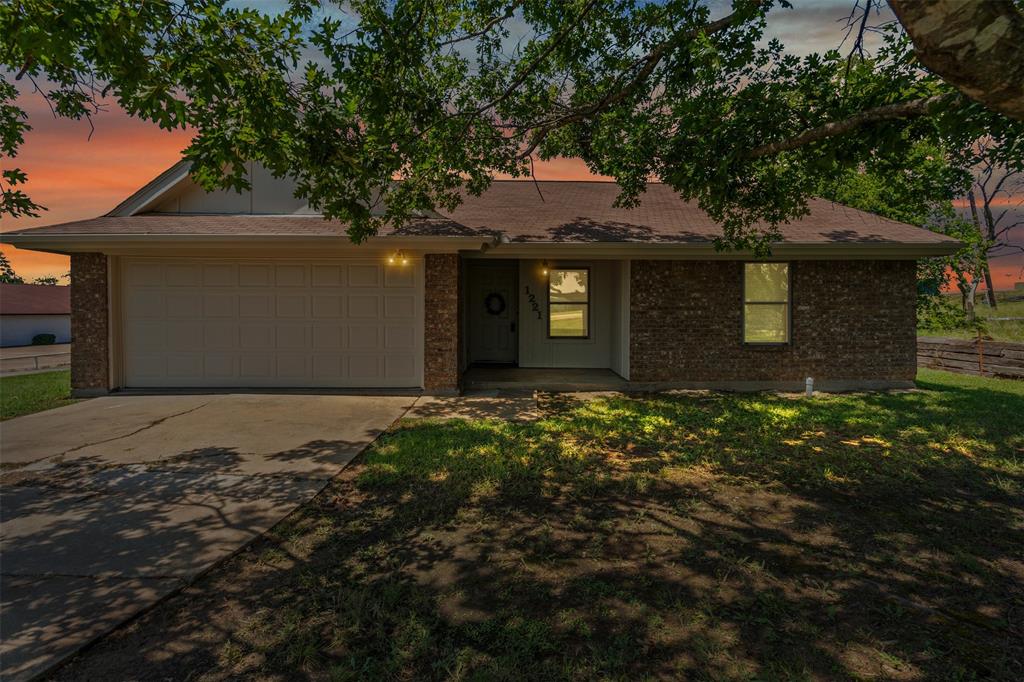 1221 East Fm 4 Cleburne, TX 76031 - Photo 2 of 35 a front view of a house with a yard
