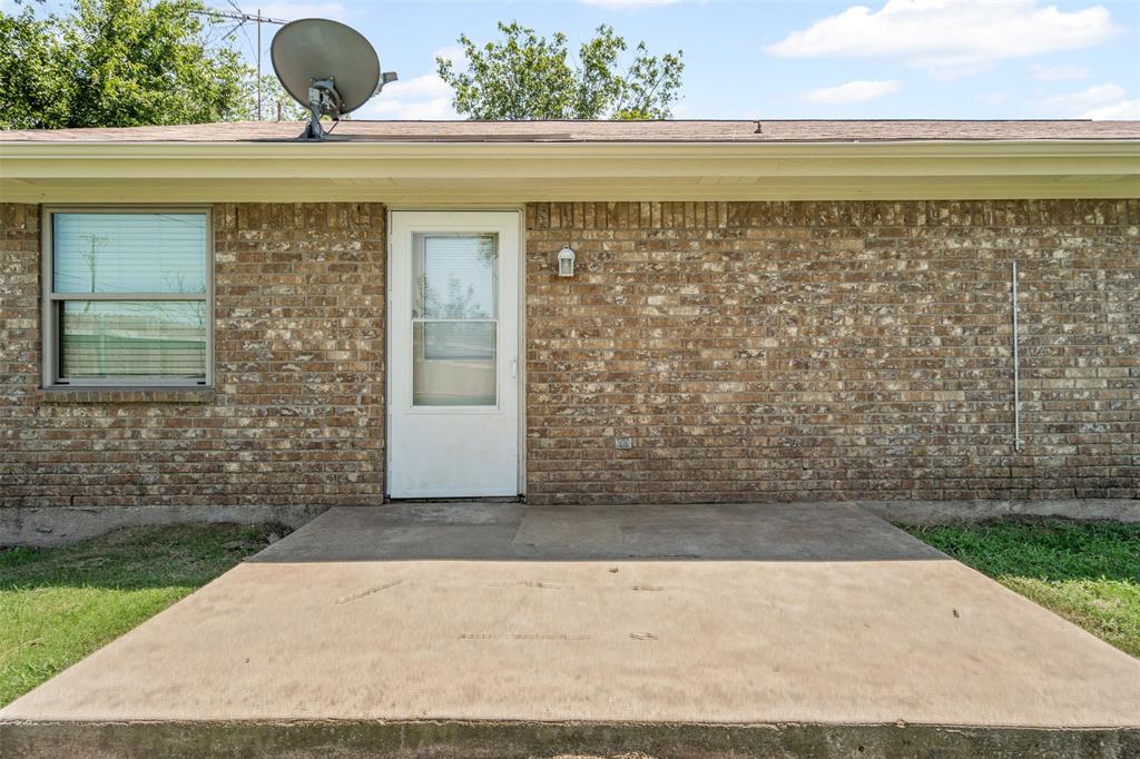 1221 East Fm 4 Cleburne, TX 76031 - Photo 25 of 35 a front view of a house with a yard