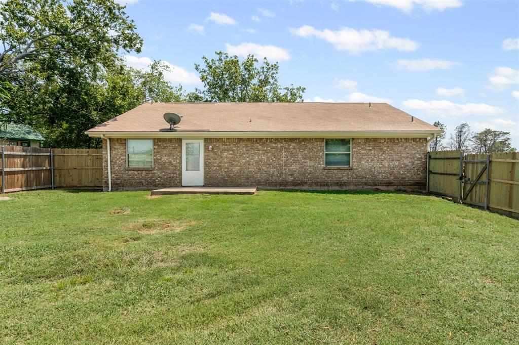 1221 East Fm 4 Cleburne, TX 76031 - Photo 27 of 35 a front view of a house with a garden