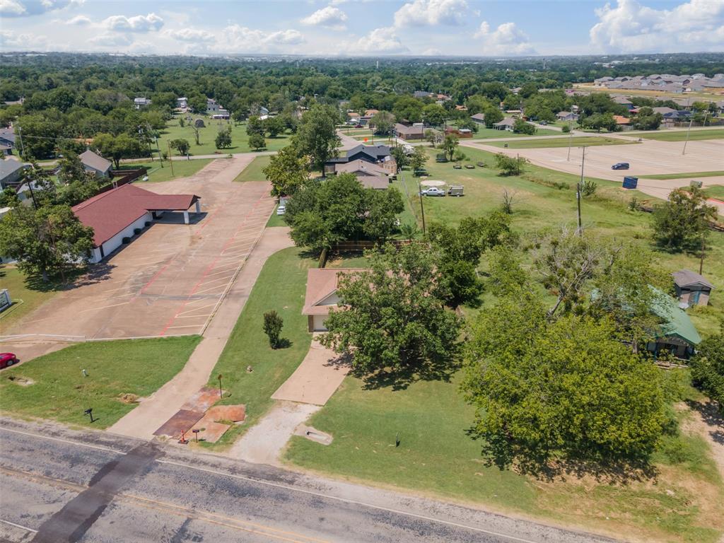 1221 East Fm 4 Cleburne, TX 76031 - Photo 29 of 35 an aerial view of residential houses with outdoor space and trees