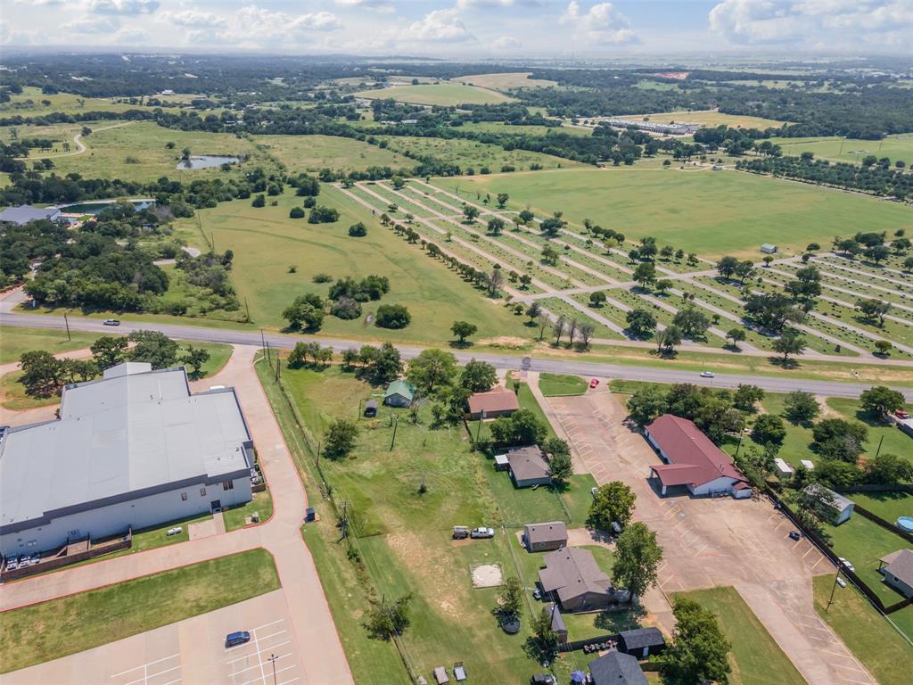 1221 East Fm 4 Cleburne, TX 76031 - Photo 33 of 35 an aerial view of lake and residential houses with outdoor space
