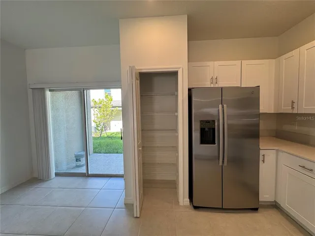 a kitchen with stainless steel appliances a refrigerator stove microwave and sink