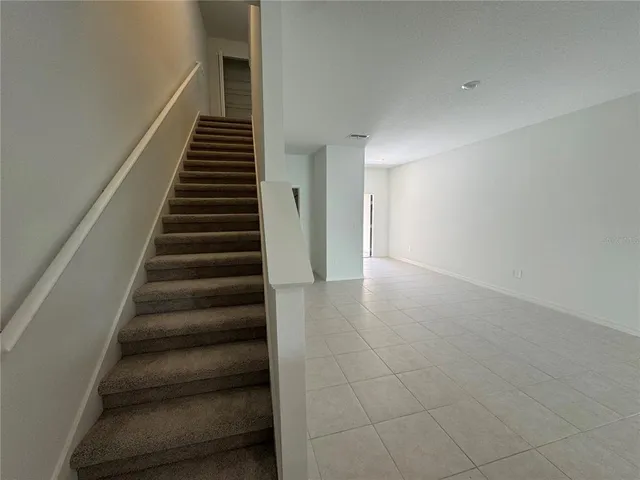 a view of a hallway with staircase