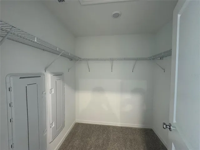 an empty room that has a mirror