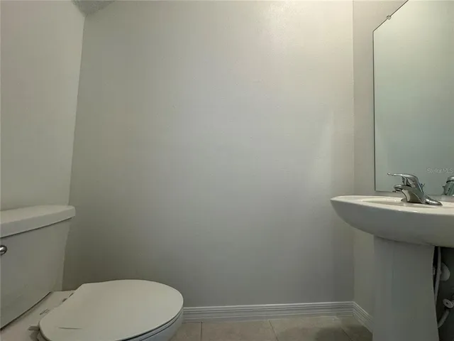 a bathroom with a sink a toilet