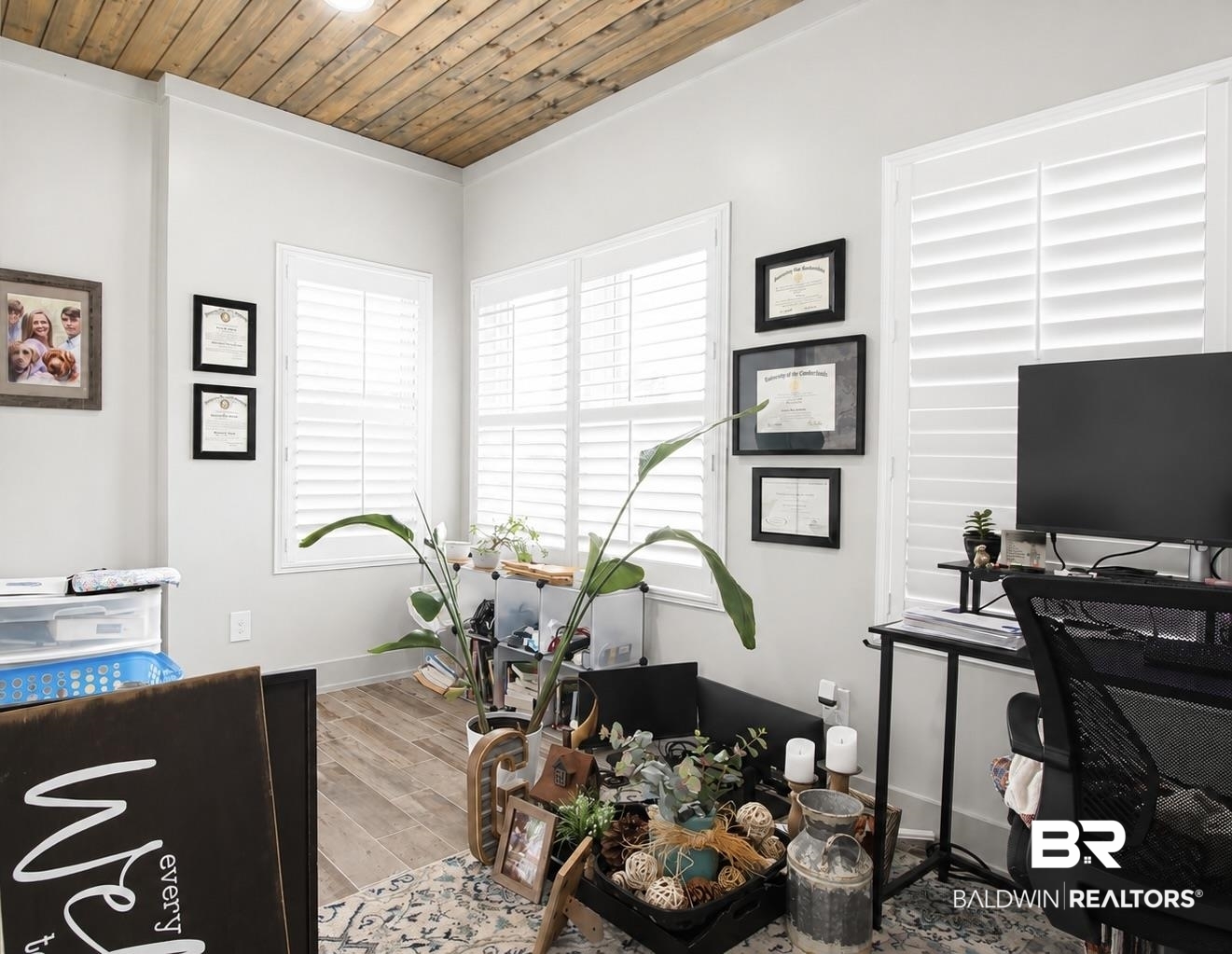 9825 Wolf Creek Ridge Elberta, AL 36530 - Photo 16 of 76 Interior space featuring a wood-panel ceiling, light gray walls, and wood-finish flooring