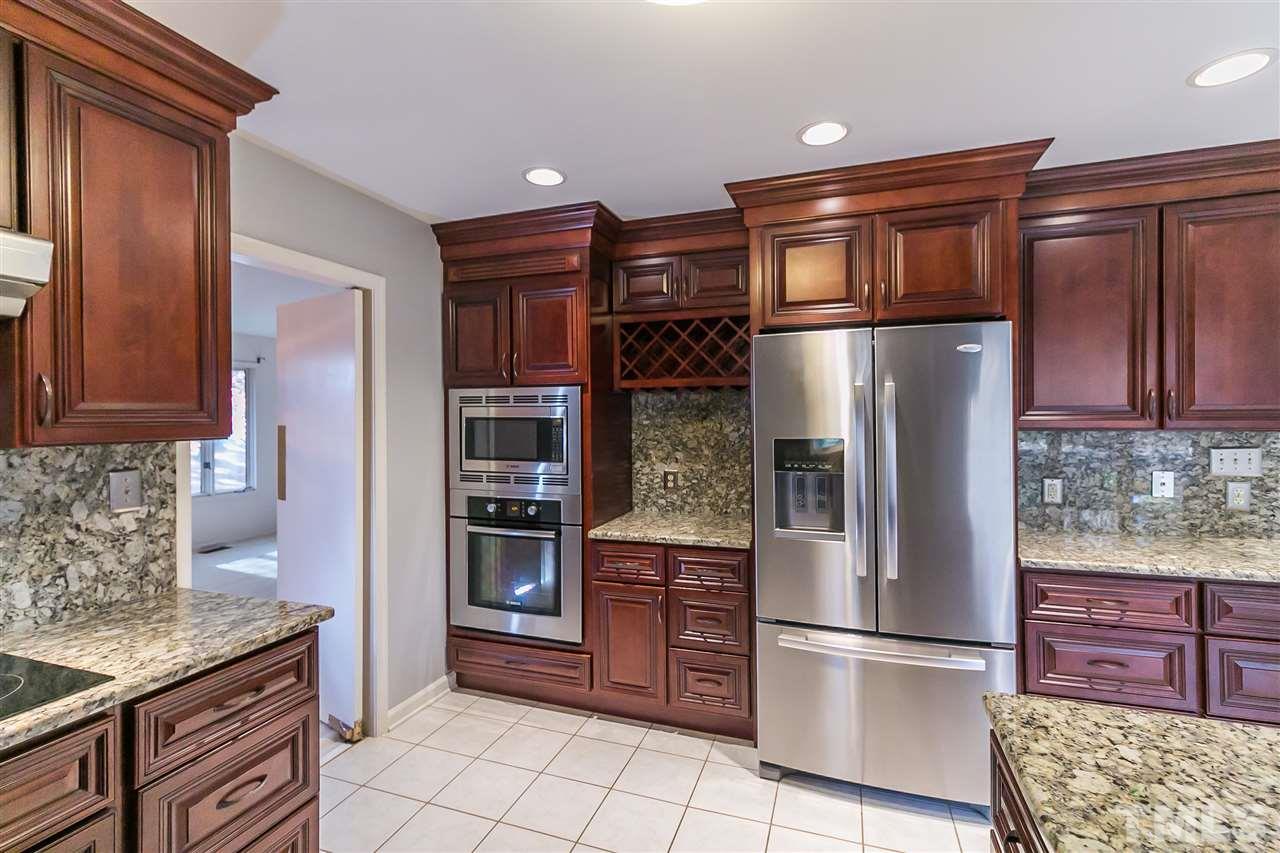 7009 Farmdale Road Raleigh, NC 27610 - Photo 4 of 25 This gourmet kitchen is perfect for the household chef.